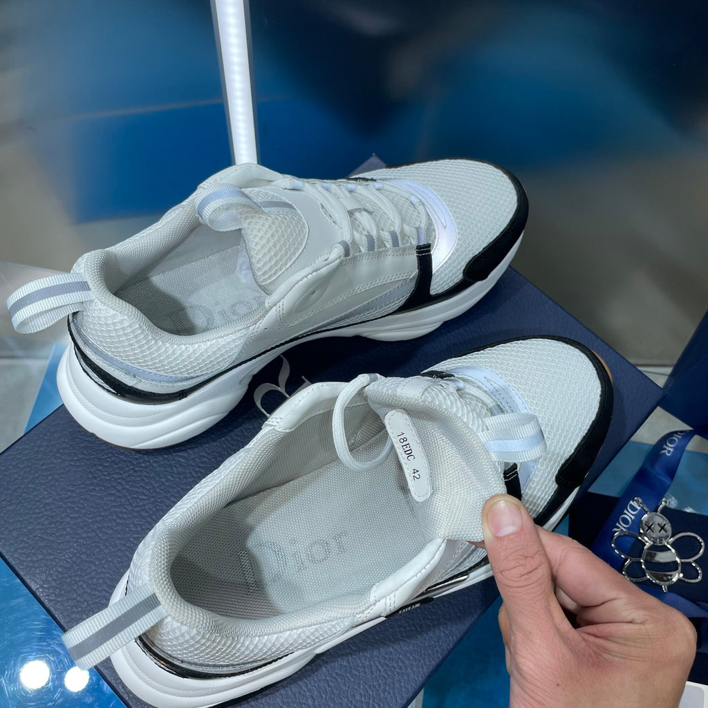 Unisex Dior sneakers, white upper with lace detail and black side stripe