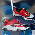 Dior chunky sneakers with red, orange, black and white mesh uppers