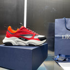Dior chunky sneakers with red uppers, orange accents, black details and white sole