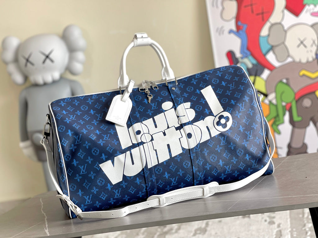 Men's blue monogram duffel bag with top handles and white strap accent