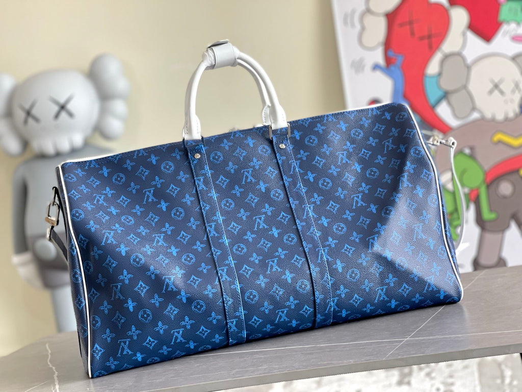 Blue monogram duffel bag with pleated sides and top carry handles