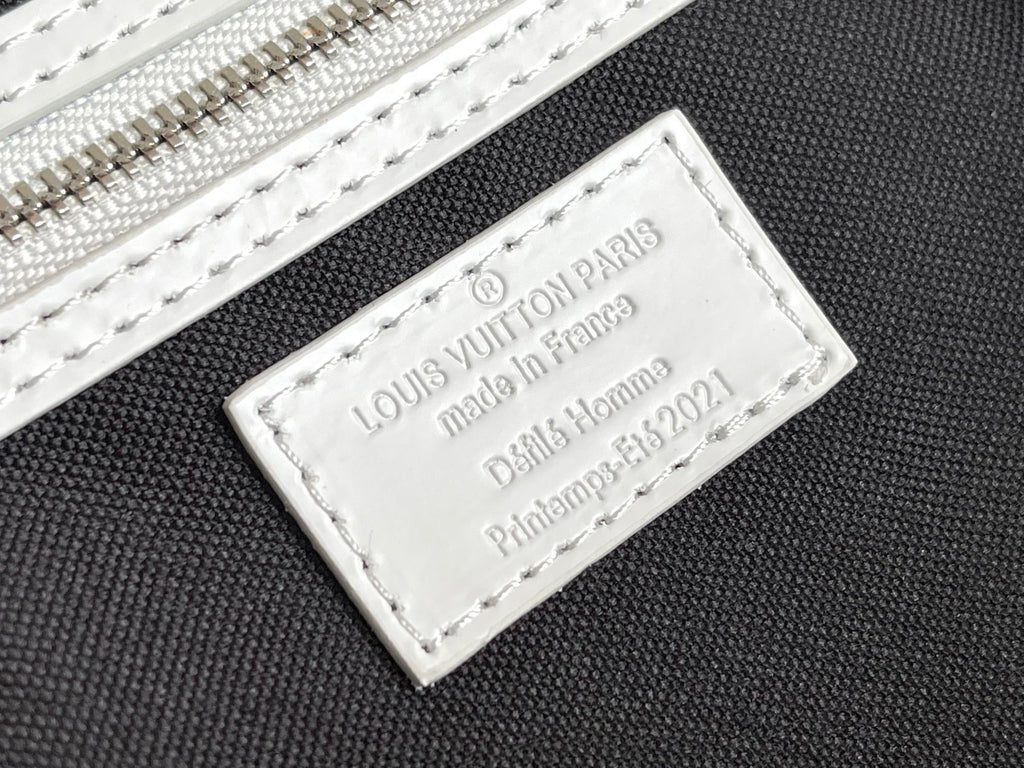 Louis Vuitton Paris leather tag with Made in France text on blue monogram bag