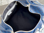 Open blue monogram duffel bag interior with zipper track and lining