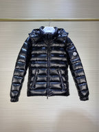 Dark puffer jacket with hood, full-zip front, quilted panels and long sleeves