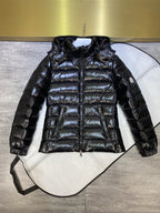 Dark puffer jacket with hood, full-zip front, quilted body and cuffed sleeves