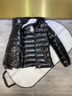 Dark puffer jacket with hood, full-zip front, quilted body and side logo patch
