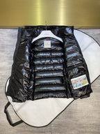 Dark puffer jacket with hood, full-zip front, quilted panels and attached tags