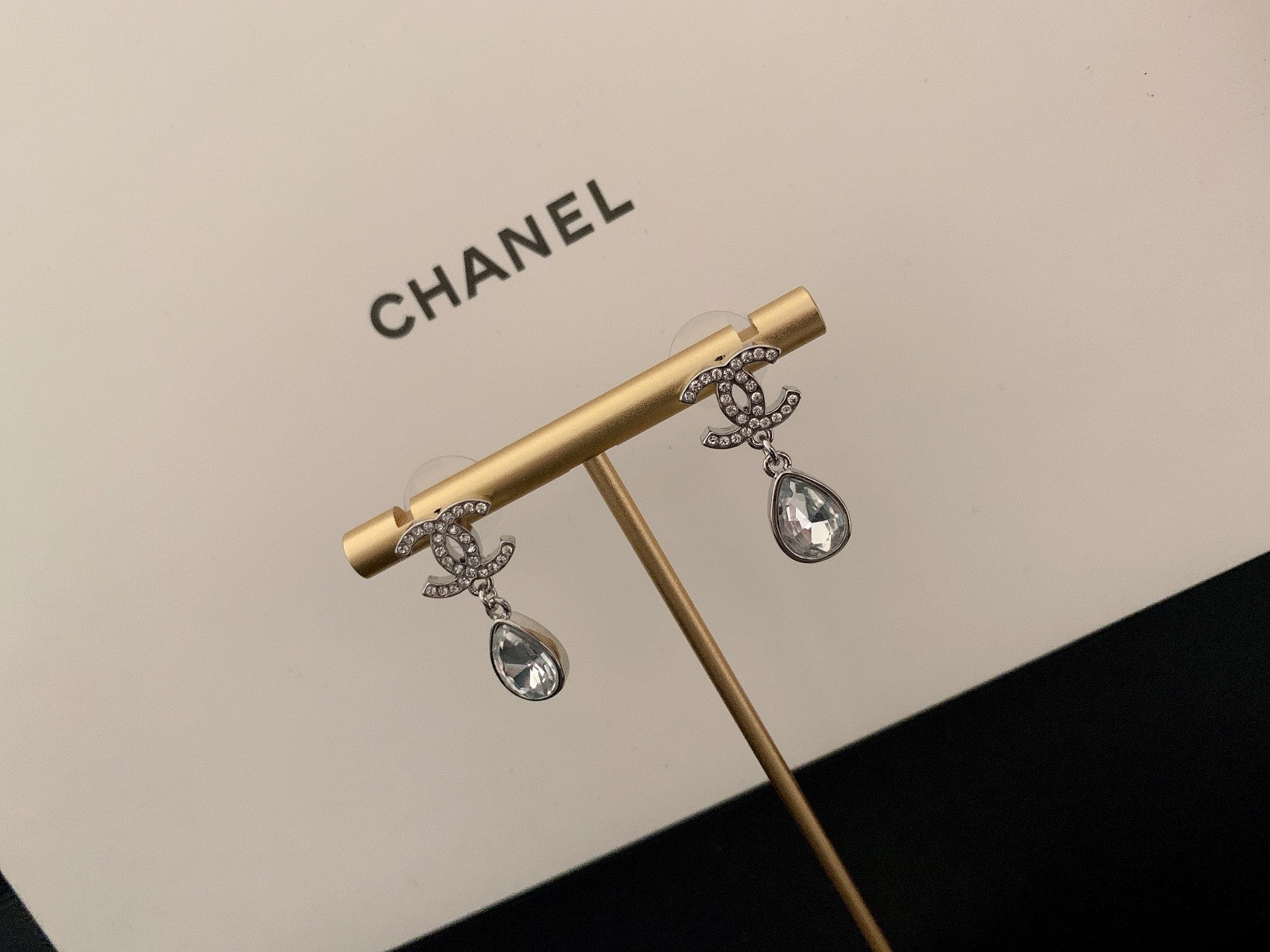 Gold-tone drop earrings with teardrop crystal dangles