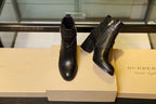 Black leather ankle boots, side view pair with block heel