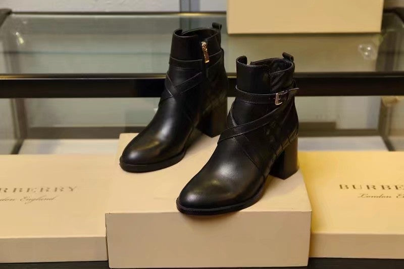 Black leather ankle boots with thick block heel and pull tab