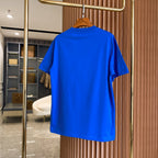 Men's blue short-sleeve T-shirt back view hanging on a wooden hanger.