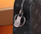 Louis Vuitton bag hardware close-up with metal D-ring and zipper pull on dark leather