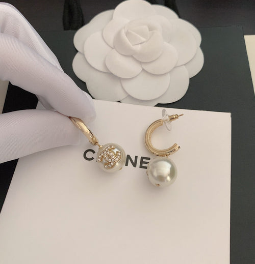 Gold-tone hoop earrings with pearl drops and round crystal stud charms