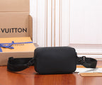 Black leather crossbody bag with front logo and twin strap ends, angled view
