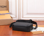 Black leather crossbody bag with top zip closure and front logo, resting view