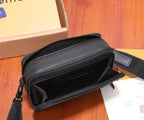 Black leather crossbody bag open view showing inner pockets and zipper track