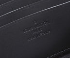 Louis Vuitton embossed lettering on black leather base