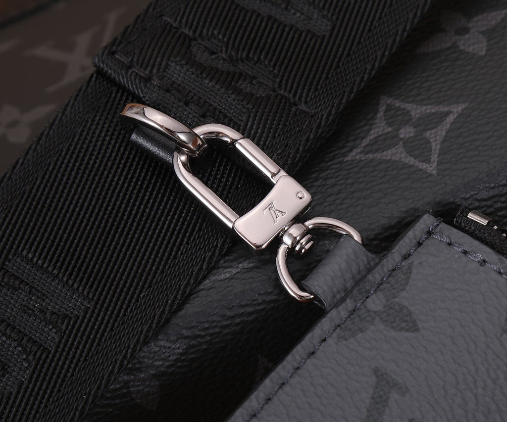 Louis Vuitton adjustable strap with silver buckle and stitched monogram panel