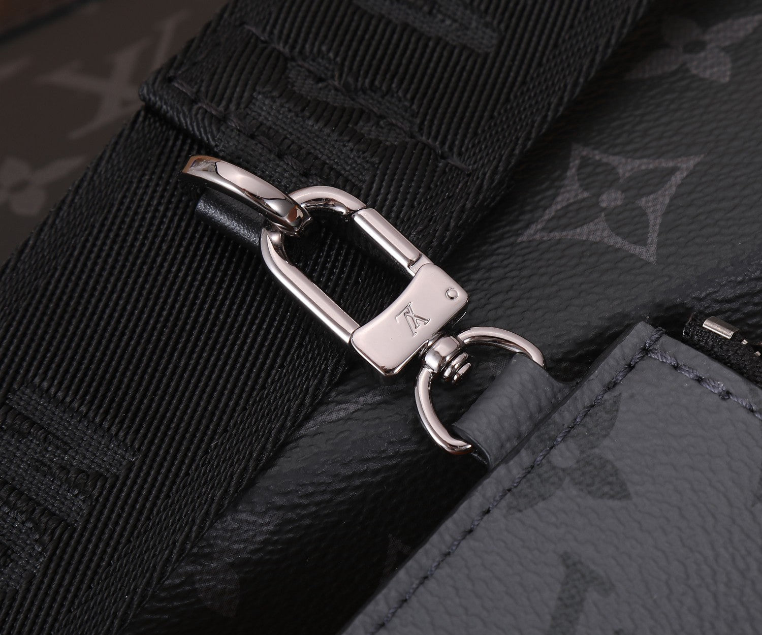 Louis Vuitton adjustable strap with silver buckle and stitched monogram panel