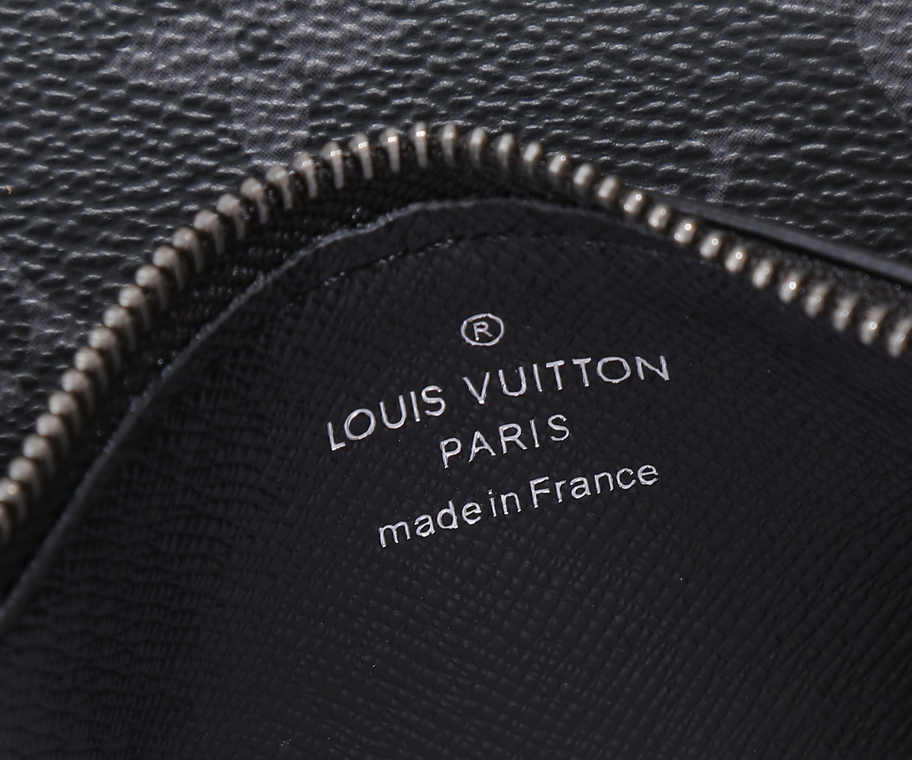 Louis Vuitton bag interior lining text "made in France", stitched black fabric