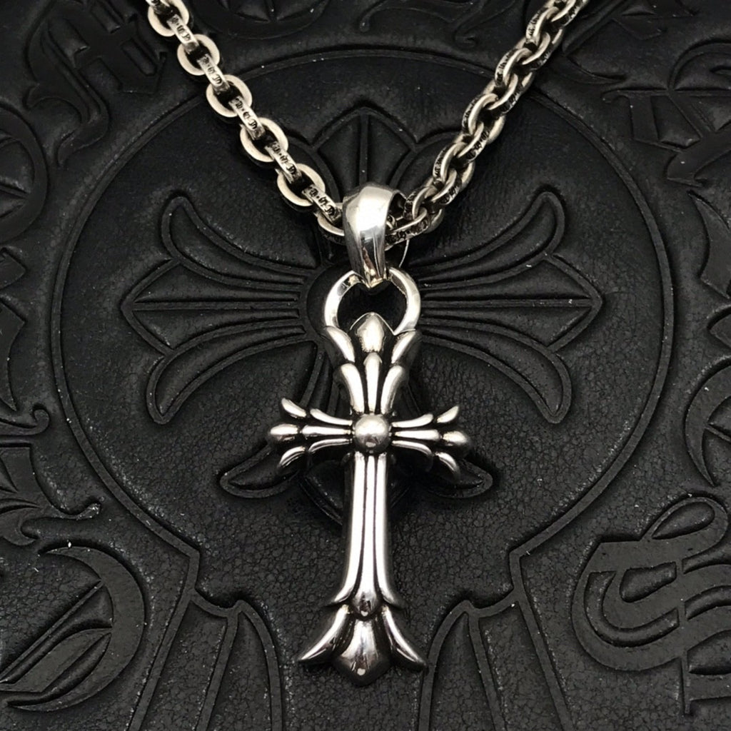 Silver-tone cross pendant necklace with curb chain and round center charm