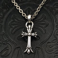 Silver-tone cross pendant necklace with curb chain and round center charm