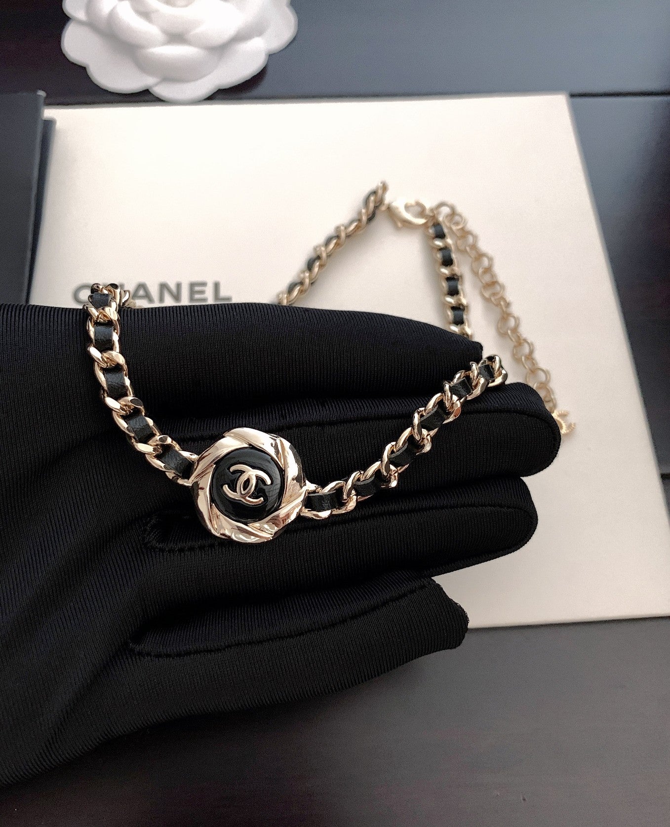 Gold-tone chain necklace with CC medallion charm on black fabric