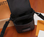 Black monogram crossbody bag open showing interior and front buckle detail
