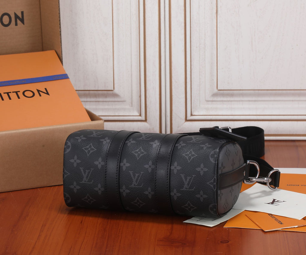 Monogram barrel handbag with top handles and side strap, dark gray/black