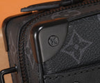 Louis Vuitton bag corner with dark leather trim and monogram texture detail.
