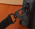 Louis Vuitton briefcase strap hardware with metal D-ring and logo pull