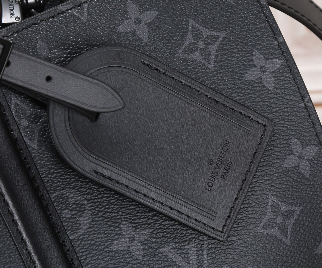 Louis Vuitton monogram tote interior pocket with embossed logo patch