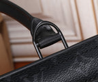 Black leather tote bag top handle with metal rings and textured grain