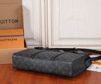 Black Louis Vuitton monogram duffel-style bag with top handles and side strap