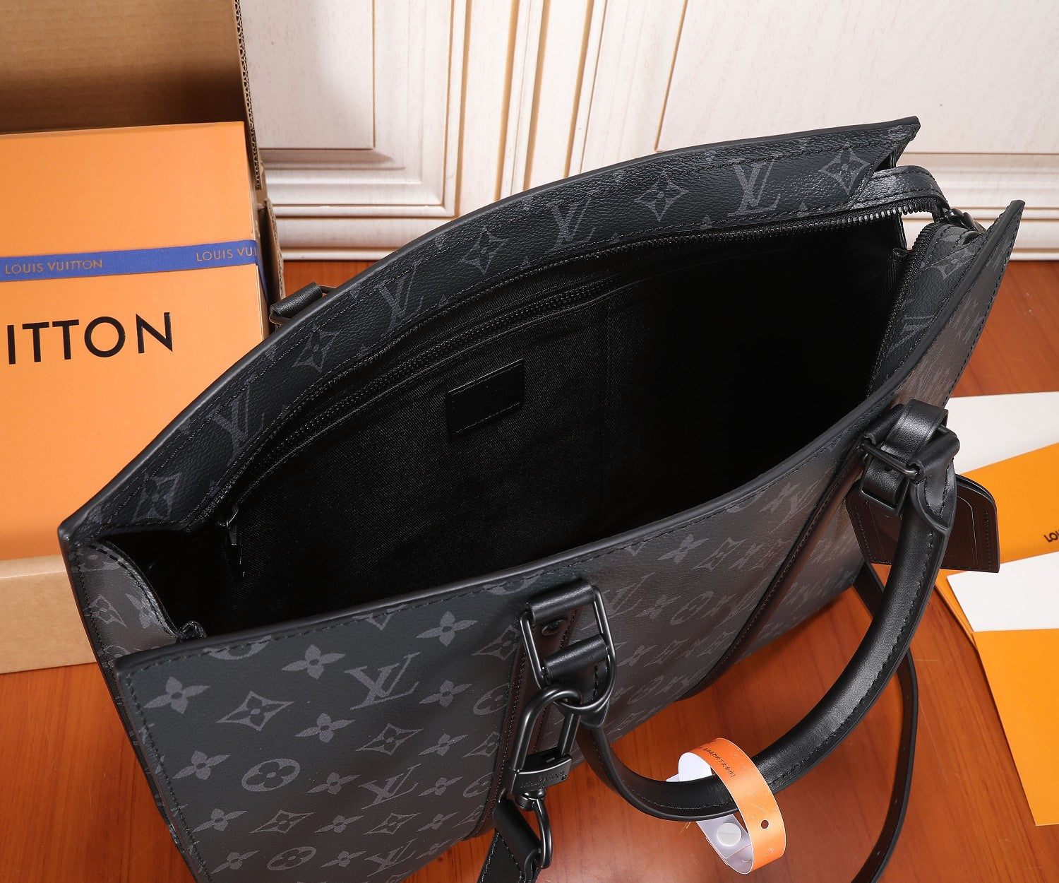 Monogram tote bag open top with leather lining and zipper pull