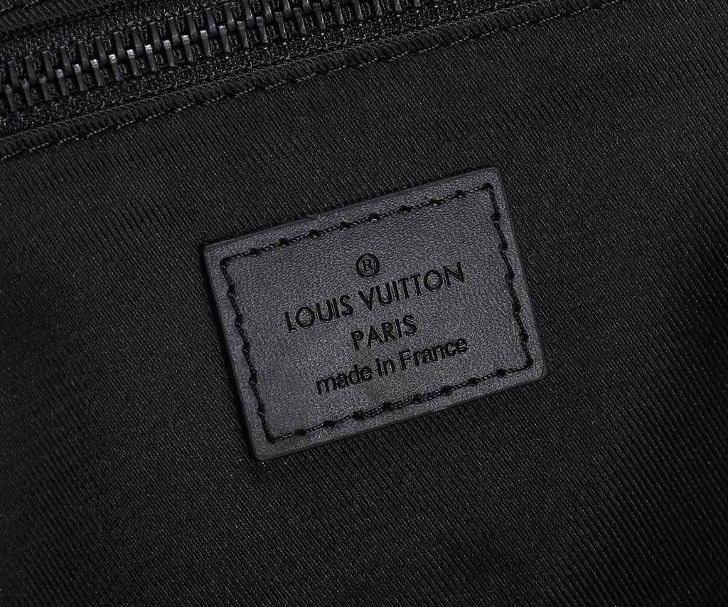 Black Louis Vuitton logo label patch with text and “made in France”