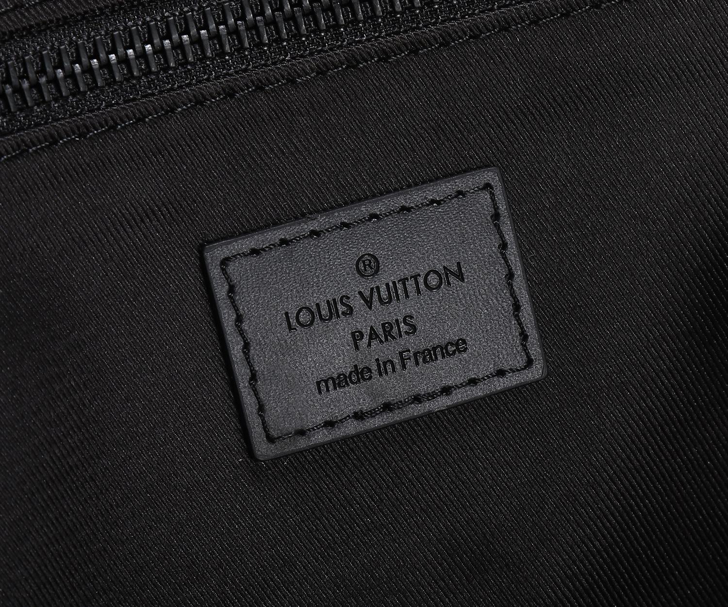Black Louis Vuitton logo label patch with text and “made in France”