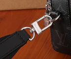 Louis Vuitton crossbody bag with silver lobster clasp and adjustable black strap