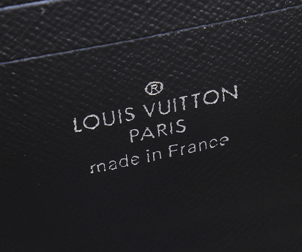 Louis Vuitton Paris made in France embossed on dark leather bag