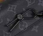 Crossbody bag hardware detail: black key ring-style D-ring on strap