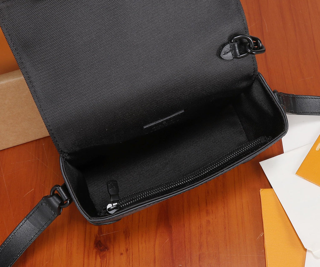 Crossbody bag open top with black fabric lining and zippered compartment