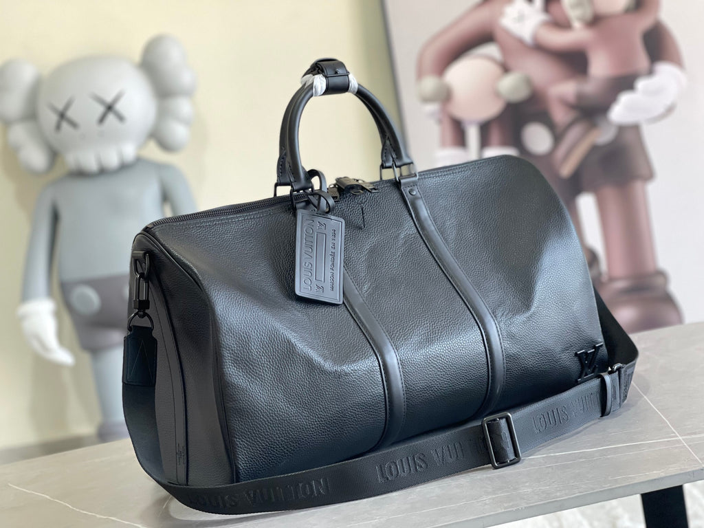 Louis Vuitton men’s duffel bag in dark blue textured leather with top handles and strap