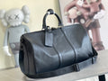 Louis Vuitton men’s duffel bag in dark blue textured leather with top handles and strap