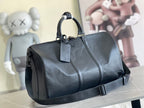 Louis Vuitton men’s duffel bag in dark blue textured leather with top handles and strap