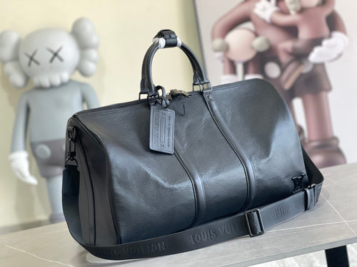 Louis Vuitton men’s duffel bag in dark blue textured leather with top handles and strap