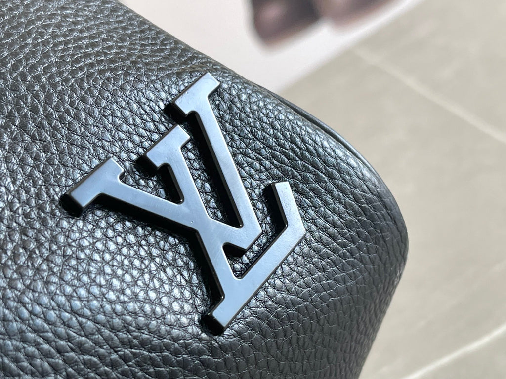 Louis Vuitton LV logo patch on dark blue textured leather duffel