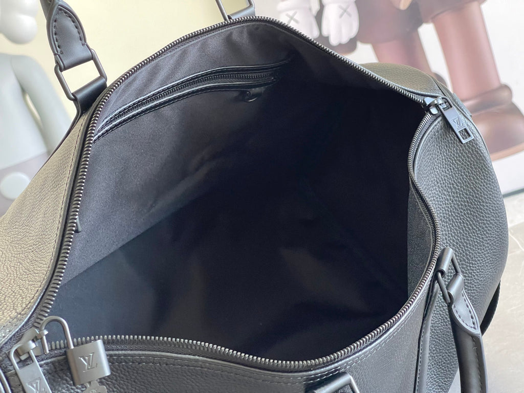 Louis Vuitton duffel bag interior with dark blue fabric lining and zipper opening