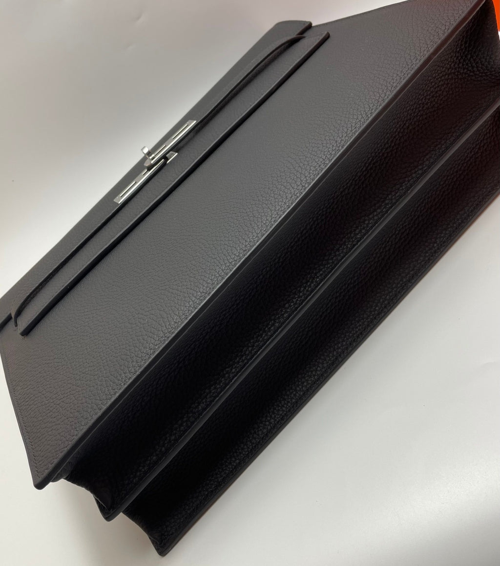 Black leather Hermes bag with long strap and silver-tone hardware
