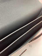 Black leather Hermes bag interior edge with zipper pull ring