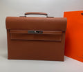 Hermes brown leather briefcase with top handle and front flap clasp